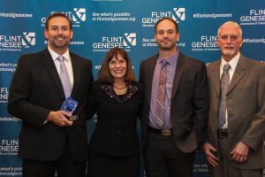 Pat, Eric and Ron Ward accept the 2015 CEO Award from the Flint & Genesee Chamber of Commerce