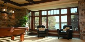 large windows in a play room with snooker table and sofa arrangement