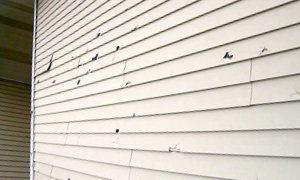 Siding-Gutter-Repair-Service-hole-damaged