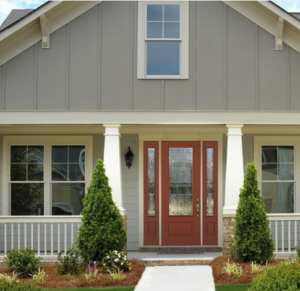Tan house with new therma-tru entry door