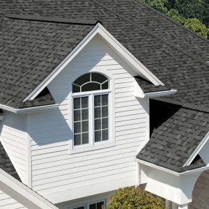 Home with white siding and grey asphalt shingles