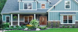 Suburban home with light blue siding 