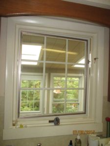 Beautiful white casement window installed over a kitchen sink.