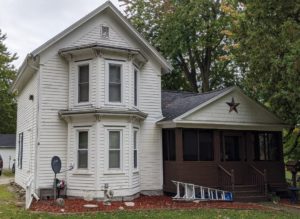 Large older home with windows installed.