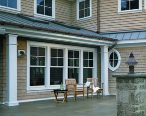 Double-hung windows facing the patio of a two story home