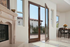 Home with glass exterior doors and windows.