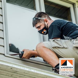 Worker replacing window