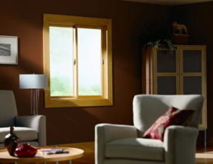 sunlight shines through a sliding window into the living area of a room