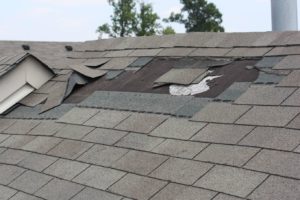 Image of a contractor repairing roofing