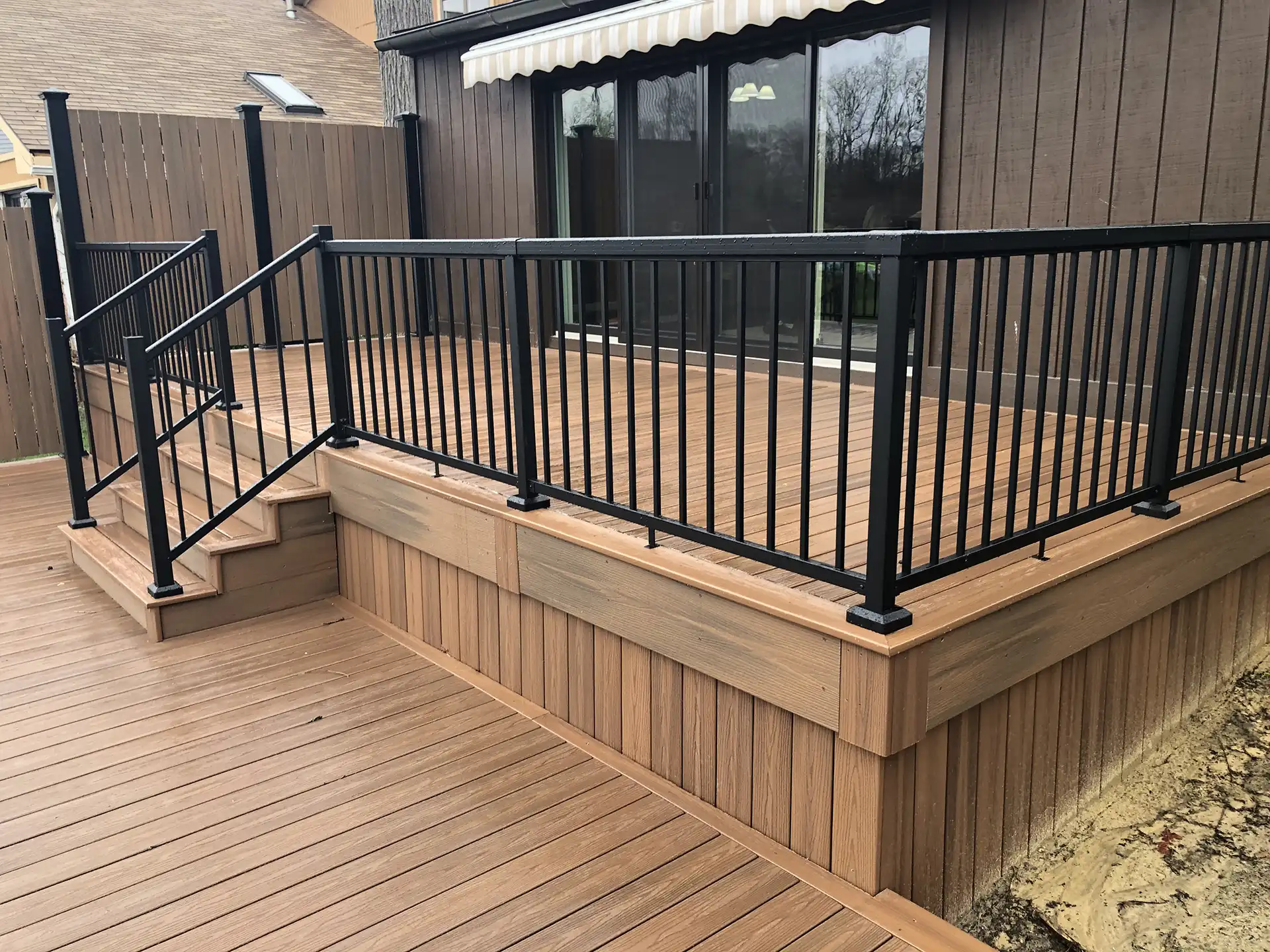 multi-level deck ideas - photo of a multi-level deck with black metal railings - Multi-level deck designs