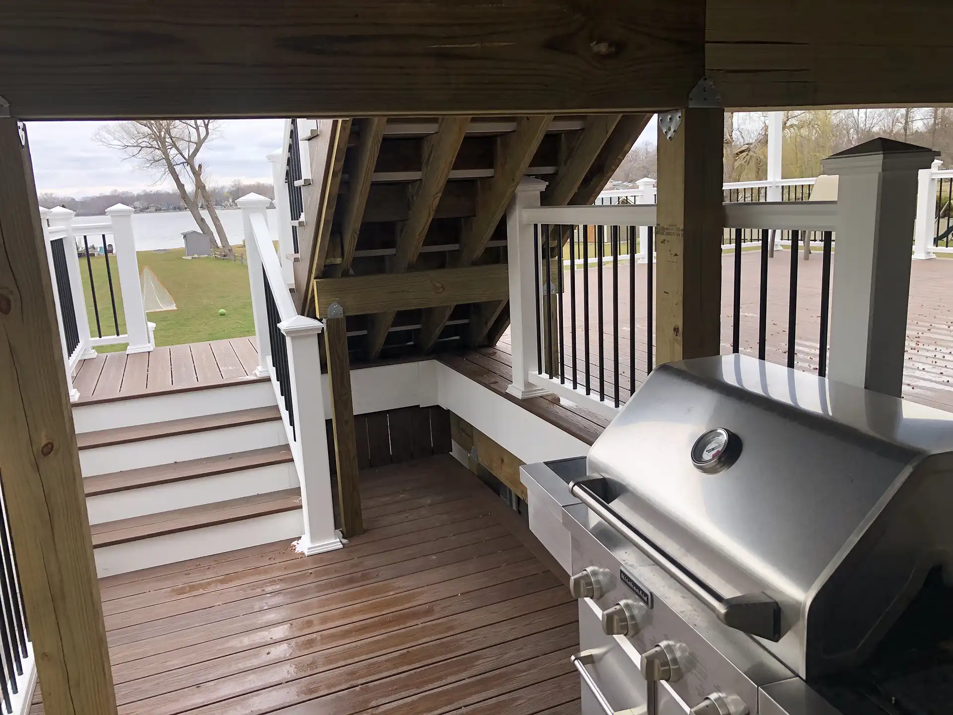 multi-level deck ideas - Photo of a grilling station on a lower level of a multi-level deck - Multi-level deck designs